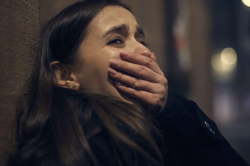 A woman in a quiet, emotional moment